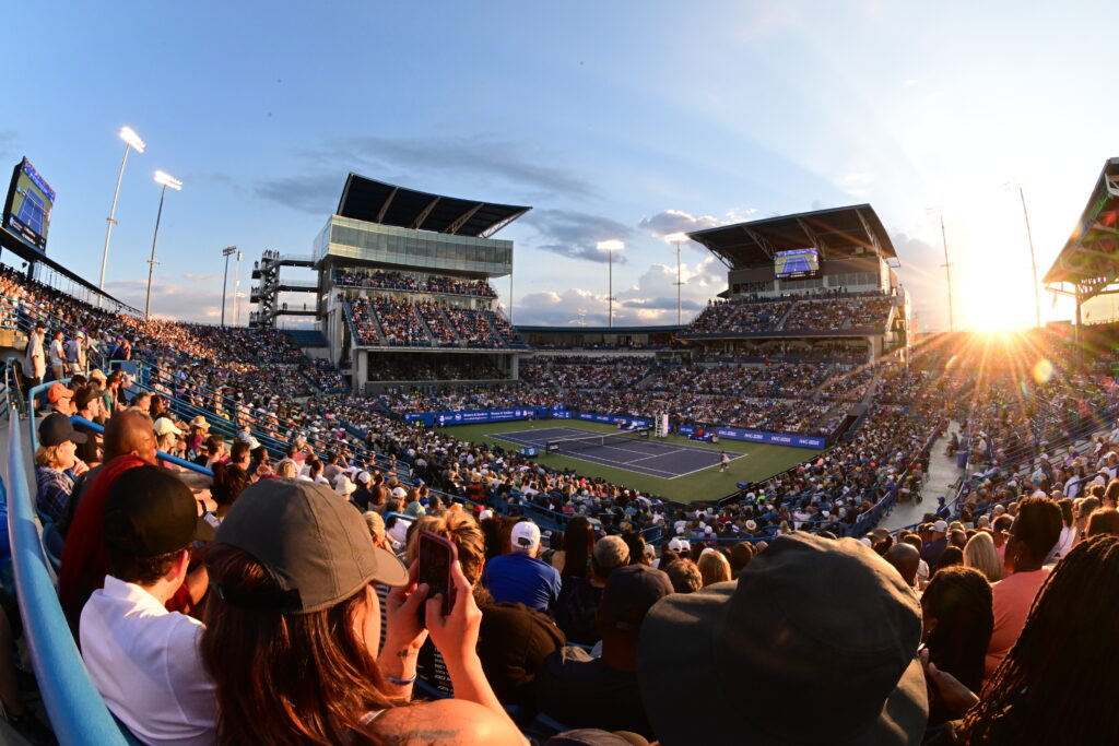 A stadium is full of fans at sunset